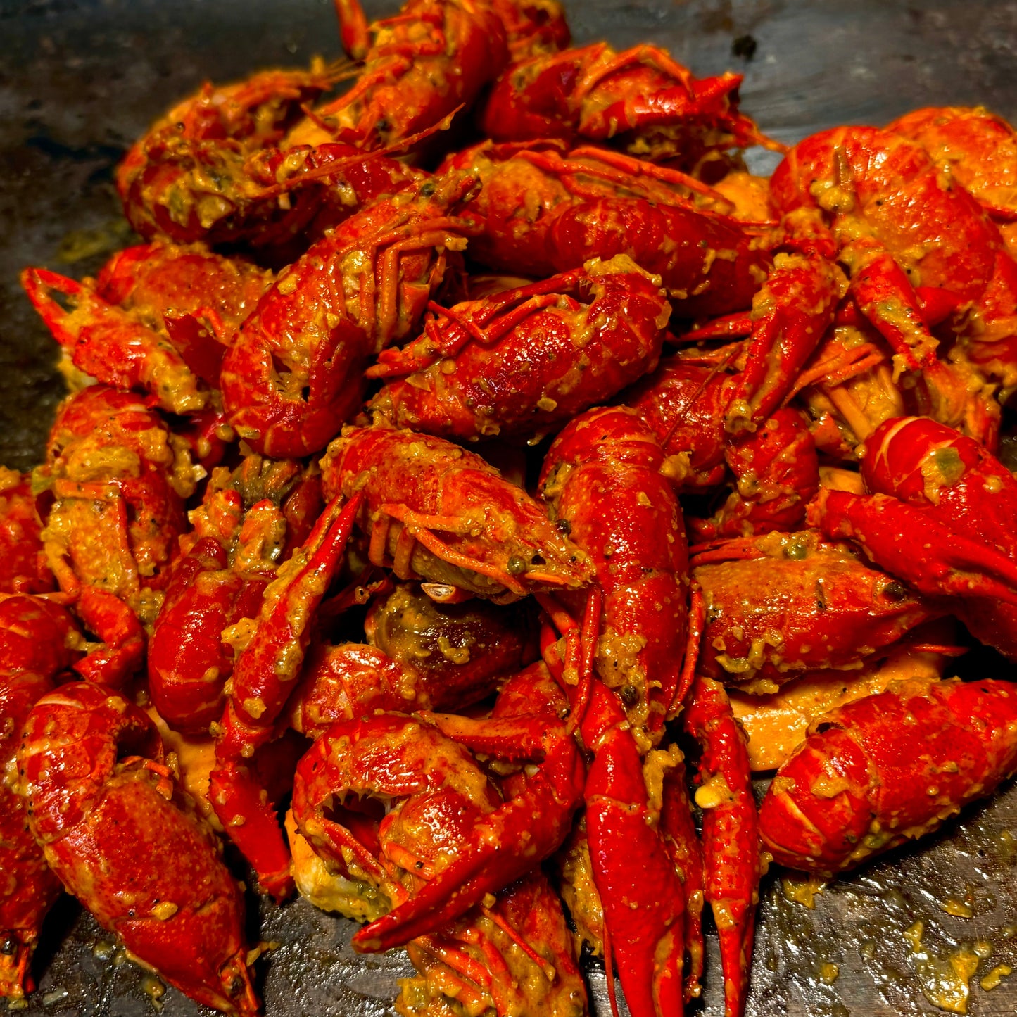 Fresh Cajun crawfish served a la carte in garlic butter at a queer-owned West Hollywood seafood spot.
