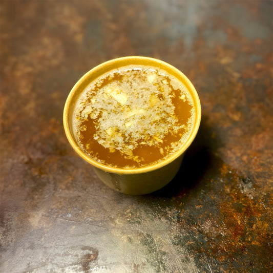 Cups of spicy Cajun butter sauces with garlic and herbs, perfect for seafood boils in West Hollywood.