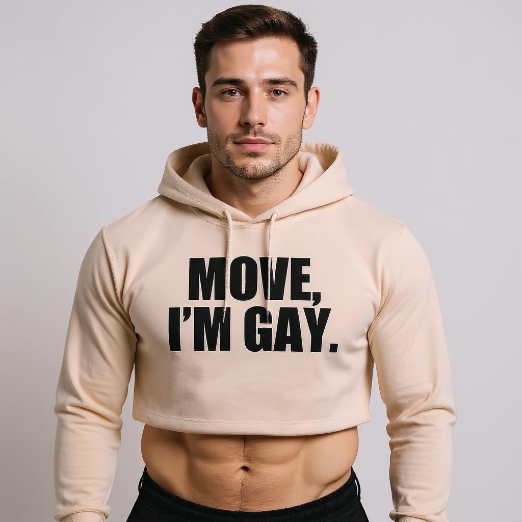 Man wearing a beige hoodie with 'MOVE, I'M GAY.' text on a plain background. LGBTQ+ merch from The Bayou WeHo in West Hollywood, Los Angeles.