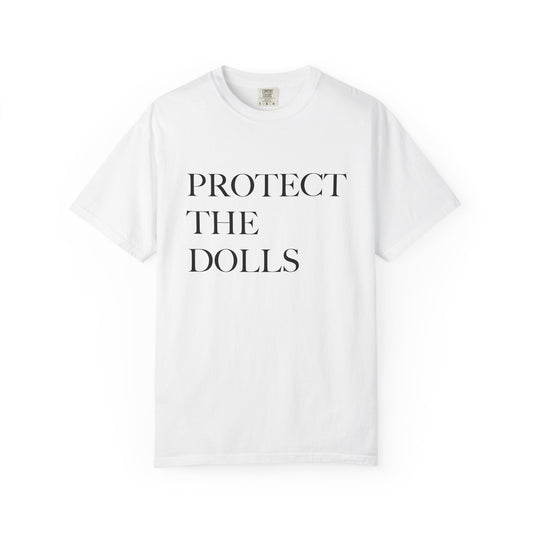 White t-shirt with 'PROTECT THE DOLLS' text on a white background