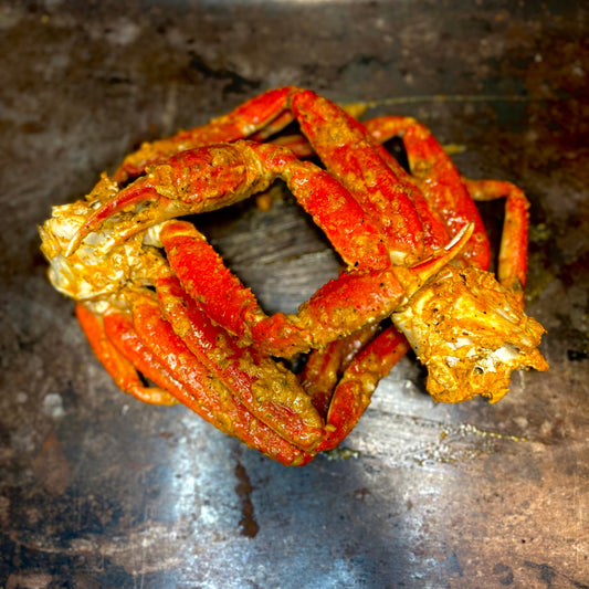 Cajun snow crab legs with garlic butter, served a la carte at a queer-owned restaurant in West Hollywood.