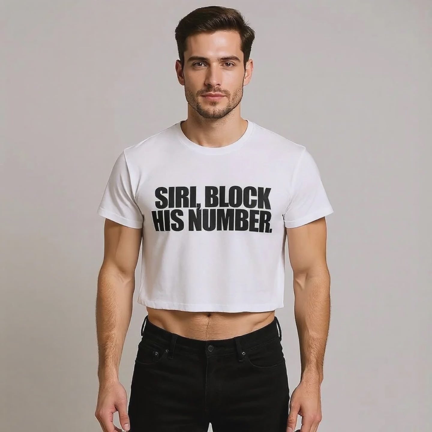 Person wearing a white crop top with bold black text reading “Siri, Block His Number”—playful LGBTQ+ streetwear style.