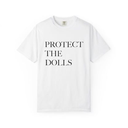 White t-shirt with 'PROTECT THE DOLLS' text on a white background