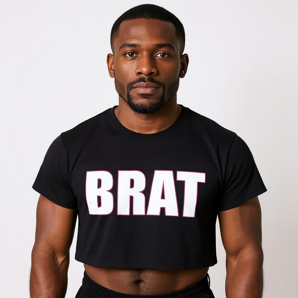 Man wearing a black t-shirt with 'BRAT' printed on it against a plain background