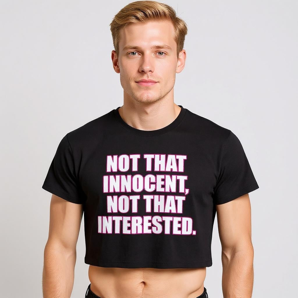 Man wearing a Britney Spears-inspired crop top that is black with white writing and pink outlining for LGBTQIA+ merch