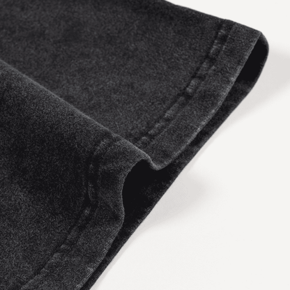 Close-up of black denim fabric on a white background