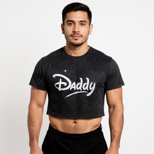 Confident man wearing a black 'Daddy' crop top in Disney-style font—a bold LGBTQ+ pride shirt and queer streetwear statement for gay fashion lovers.