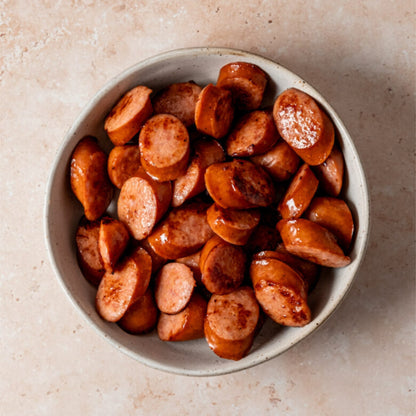 Smoky Cajun Andouille sausage slices from The Bayou WeHo—bold, savory bites that bring Louisiana flavor to the heart of West Hollywood’s gay nightlife.