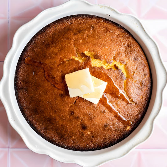Fresh-baked 6-inch honey butter cornbread drizzled with golden syrup from The Bayou WeHo—sweet, Southern comfort loved by the West Hollywood gay community.