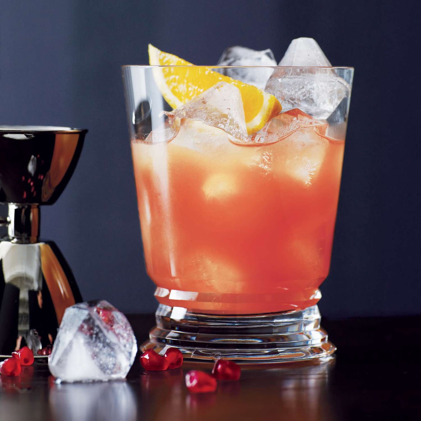 A vibrant citrus cocktail on the rocks garnished with fresh orange slices, served at The Bayou WeHo—West Hollywood’s go-to gay bar for affordable happy hour drinks and queer-friendly vibes.