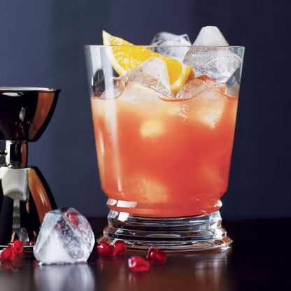 A vibrant citrus cocktail on the rocks garnished with fresh orange slices, served at The Bayou WeHo—West Hollywood’s go-to gay bar for affordable happy hour drinks and queer-friendly vibes.