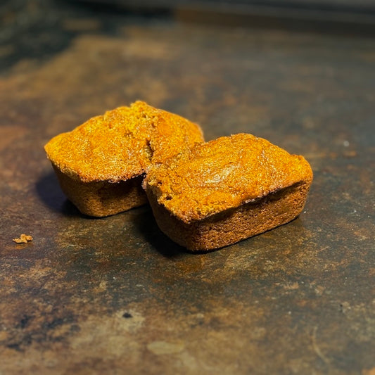 best new food in WeHo: two honey butter cast iron cornbreads on a metal flat top