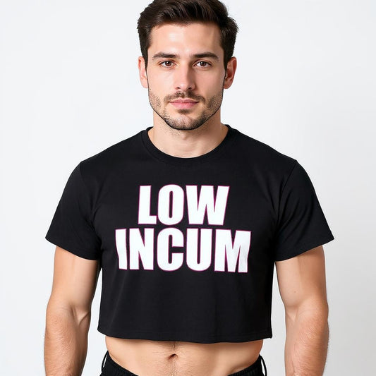 Confident man wearing a black gender-inclusive crop top with bold white and pink text that reads “LOW INCUM,” representing queer humor and LGBTQ+ streetwear culture.