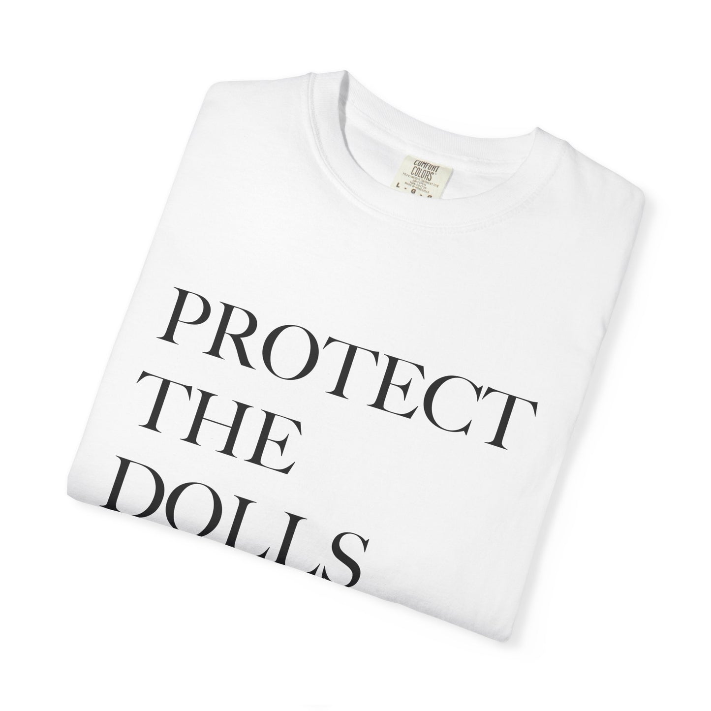 White t-shirt with 'PROTECT THE DOLLS' text on a white background