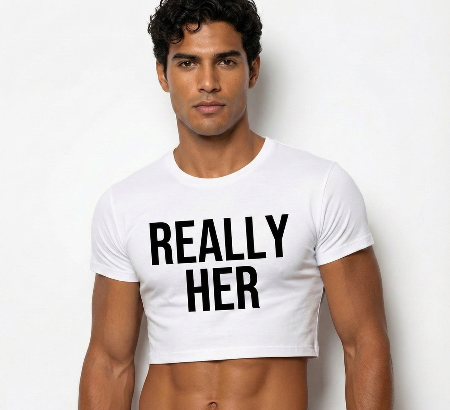 cheap crop tops made for gay men—really? Her black lettering on a white cotton crop top with a Latin male model.