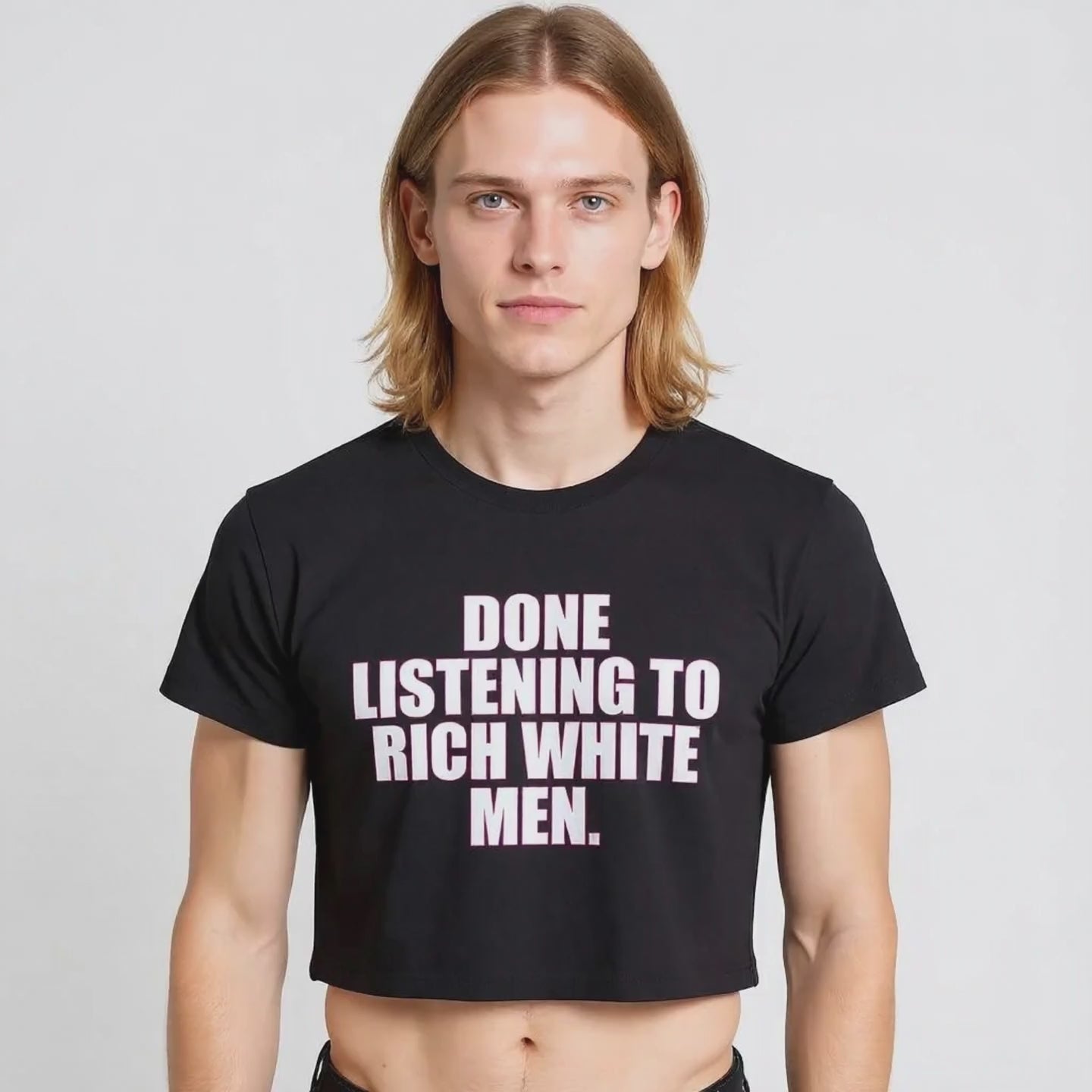 Black crop top with bold white and pink block text reading “Done Listening to Rich White Men”—a statement tee for activism and LGBTQ+ ally style.