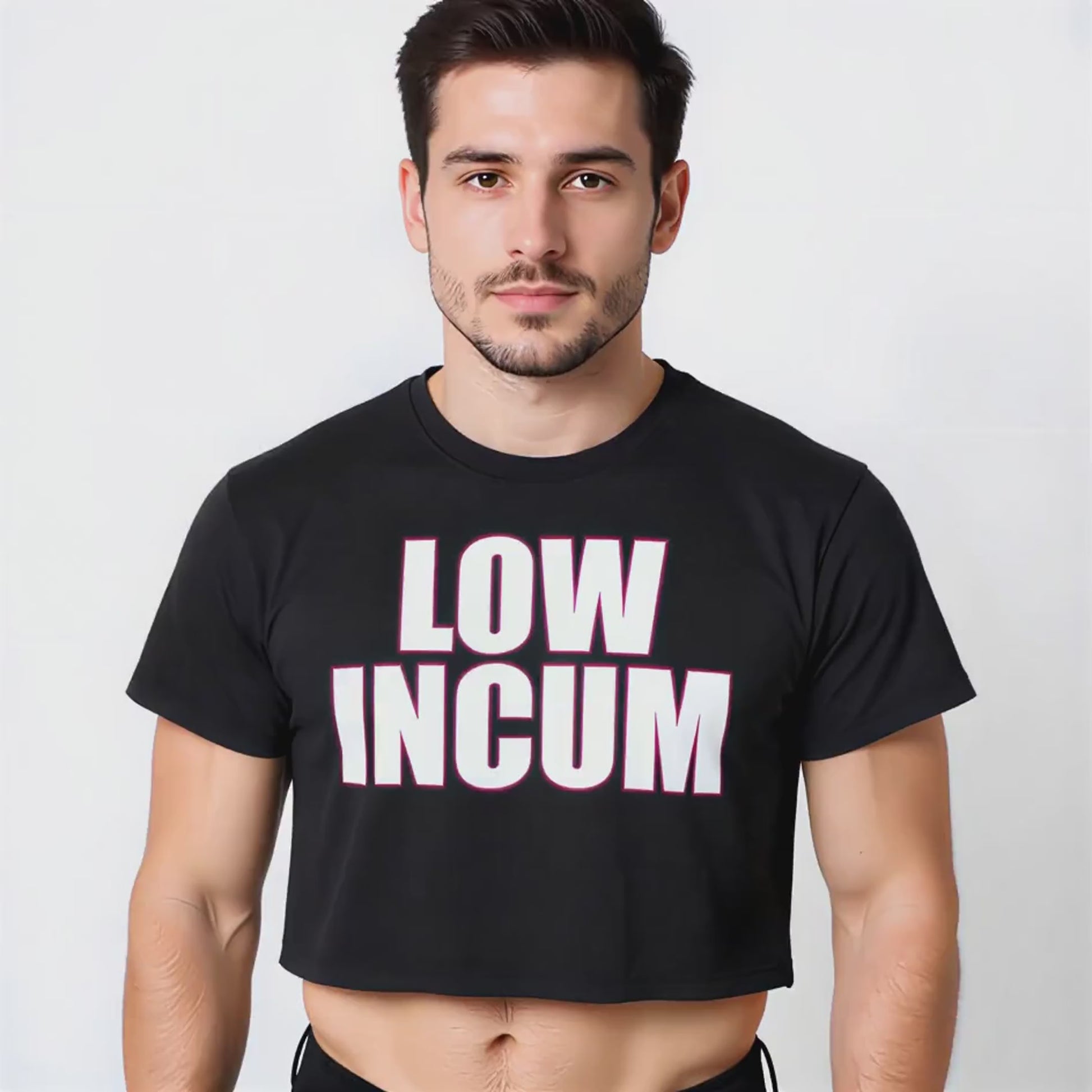 A dark-haired model wearing a black crop top with bold white-and-pink lettering that reads “LOW INCUM,” styled as queer-inclusive streetwear.