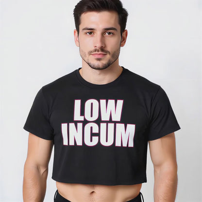 A dark-haired model wearing a black crop top with bold white-and-pink lettering that reads “LOW INCUM,” styled as queer-inclusive streetwear.
