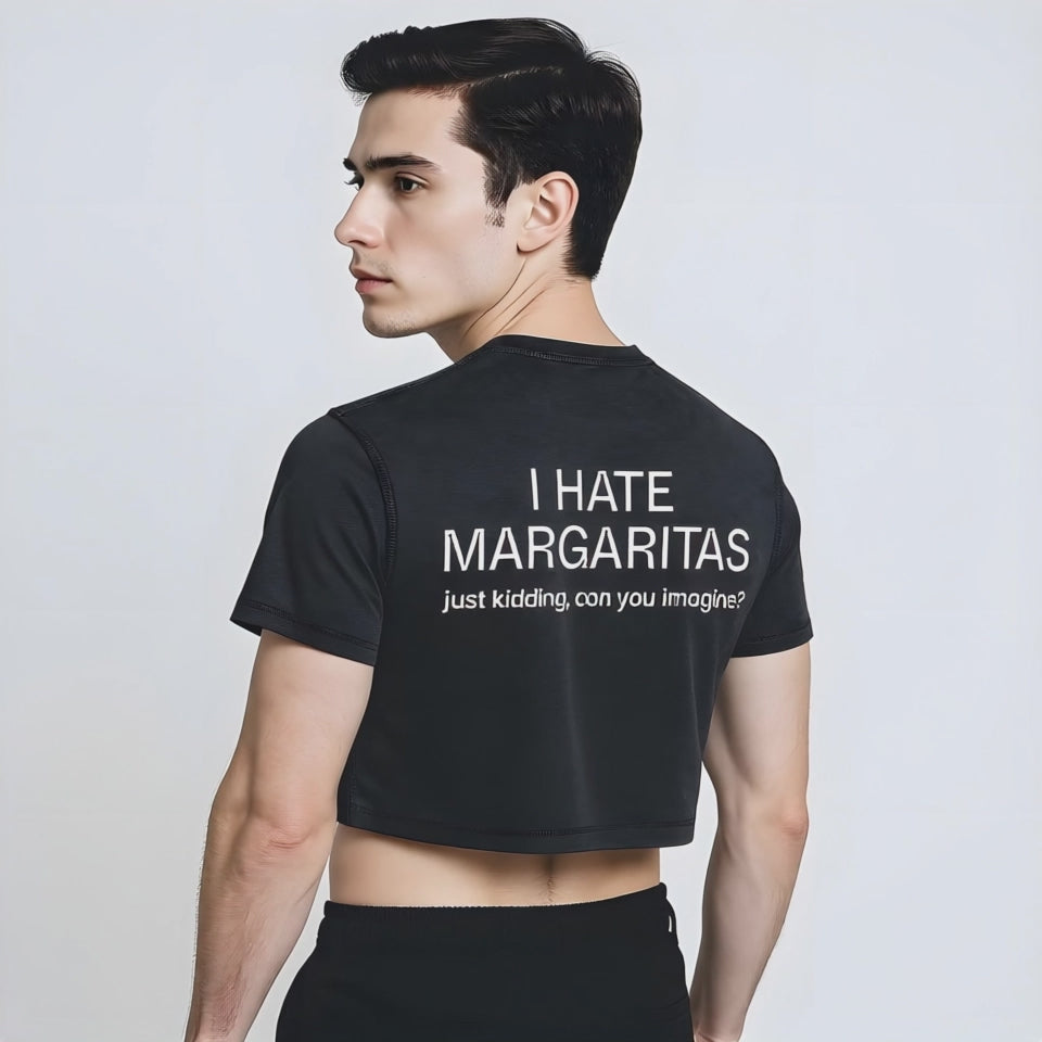 Black vintage-style crop top with bold white text on the back reading “I HATE MARGARITAS—just kidding, can you imagine?” showcasing queer humor, brunch-ready fashion, and gender-inclusive streetwear.